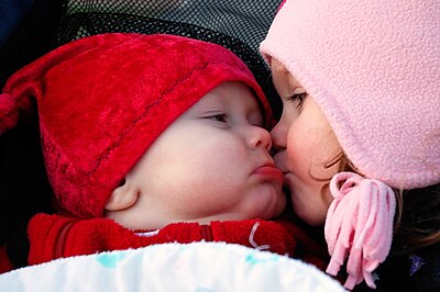 Smooches (baby and child kiss).jpg